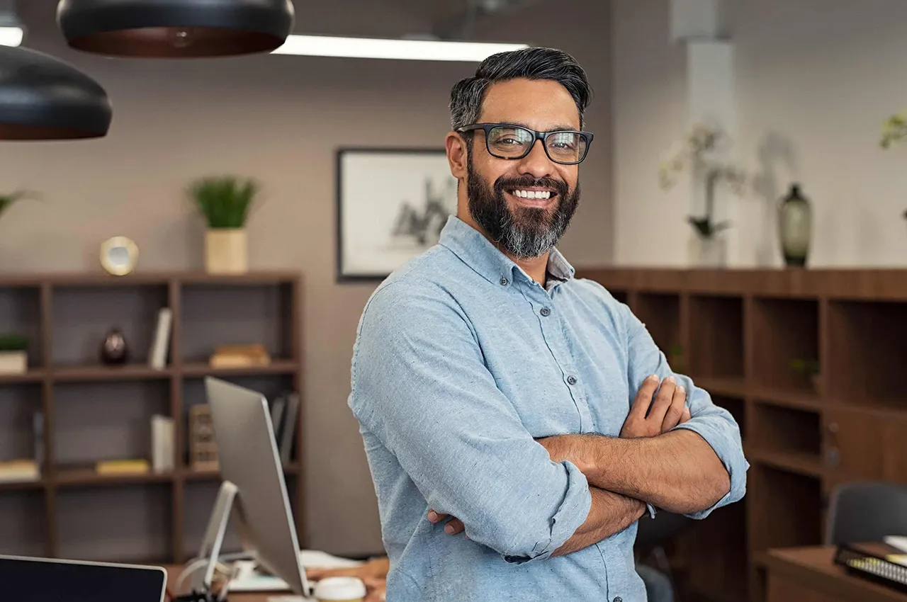 Man in office smiling