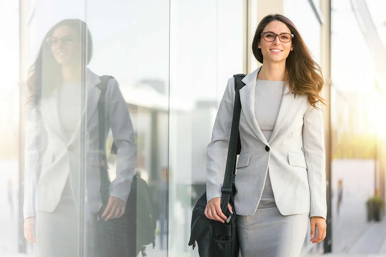 Business woman walking by building