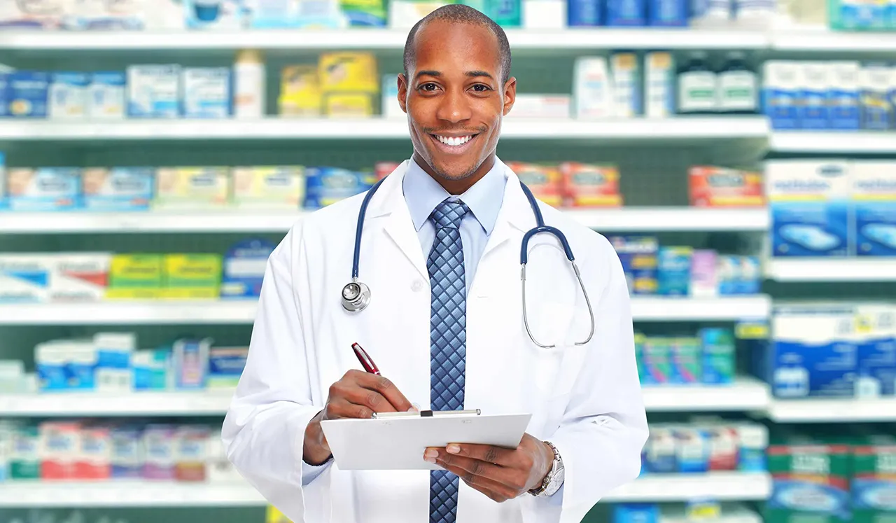 Male African American pharmacist with clipboard
