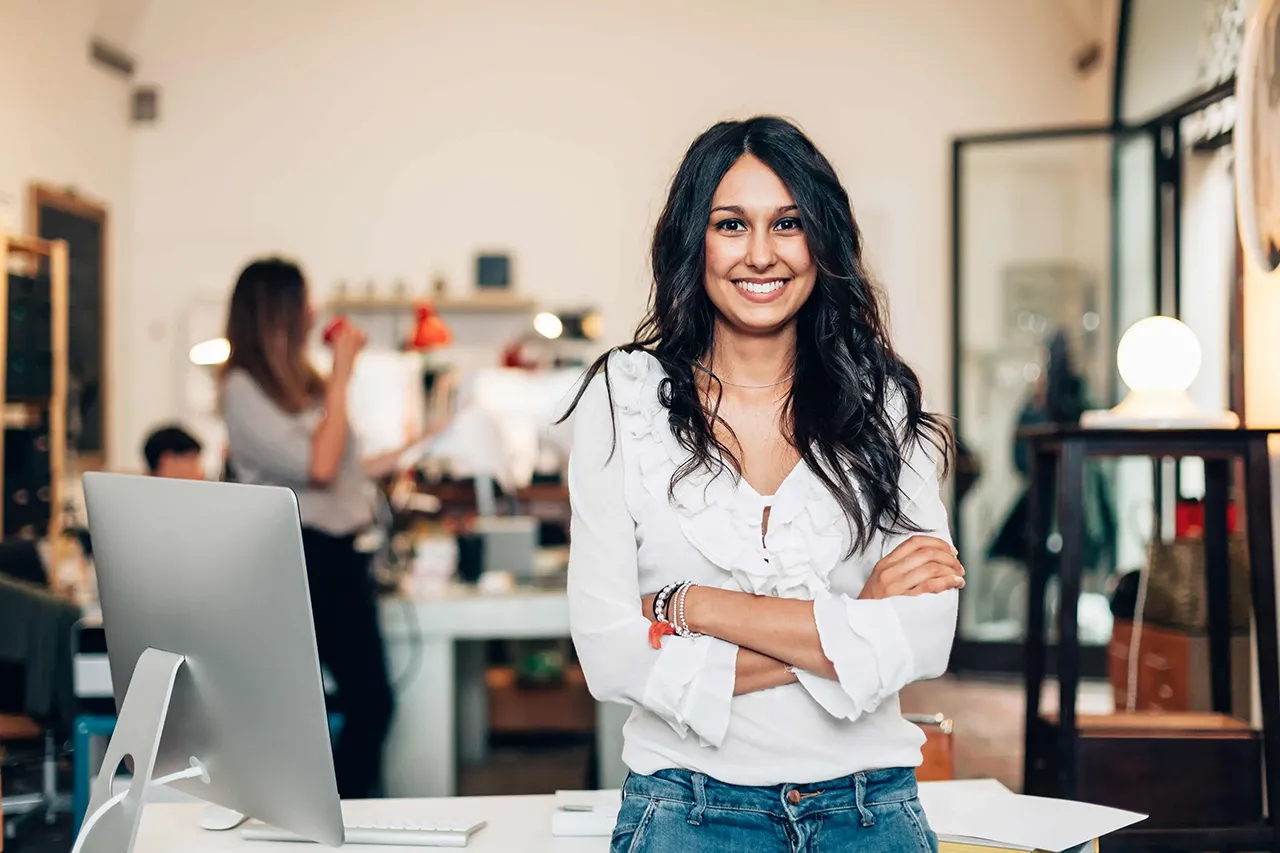 Smiling woman standing in office